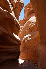 Image showing Narrow slot between two orange rocks desert canyon