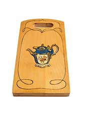 Image showing Wooden cutting board painted with teapot isolated