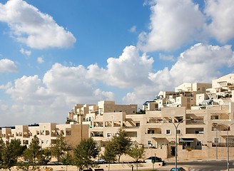 Image showing New three-storeyed apartment buildings under blue cloudy sky