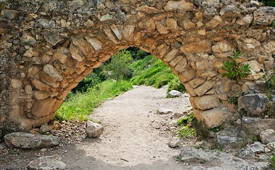 Image showing Ancient stone arch on the hiking trail outdoor