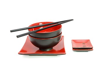 Image showing Red and black oriental table set isolated