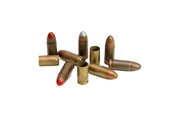 Image showing Pile of 9mm Parabellum cartridges and spent cases isolated