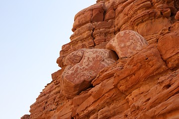 Image showing Erosion reliefs on red sandstone rocks in desert