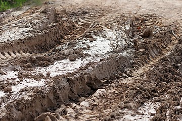 Image showing Closeup of car ruts in dry road mud 