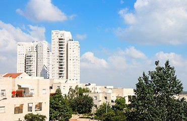 Image showing New white apartment buildings under blue cloudy sky