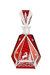 Image showing Red crystal carafe with cut prancing deer isolated