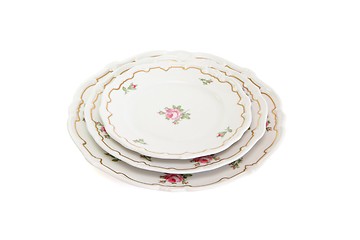 Image showing Stack of three white dinner plates and saucers  isolated