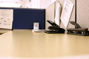 Image showing Office desk with Hole Puncher and Stapler