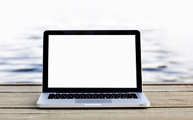 Image showing Laptop on a footbridge