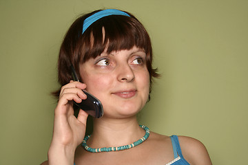 Image showing young woman calling by cellular phone