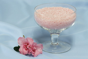 Image showing Pink bath salts with blossom