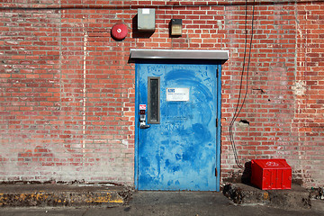 Image showing Blue Door with Red Bricks