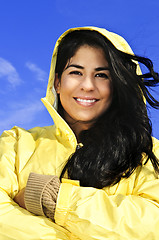 Image showing Beautiful young woman in raincoat