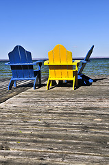 Image showing Chairs on wooden dock at lake