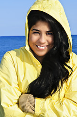 Image showing Beautiful young woman in raincoat