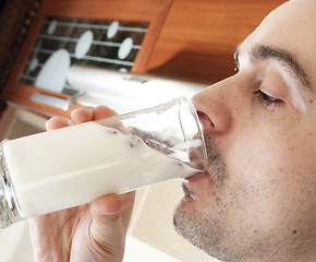 Image showing Young people eating milk with cereals