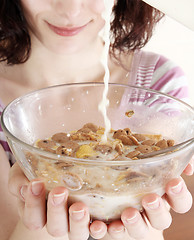 Image showing Young people eating milk with cereals