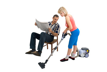 Image showing The husband,  wife and a vacuum cleaner