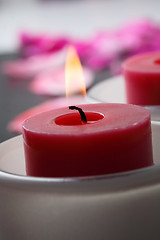 Image showing Candle and flower petal decoration.