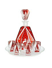 Image showing Red crystal carafe and liqueur-glasses on round plate isolated