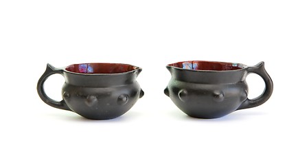 Image showing Two black decorative ceramic pots isolated