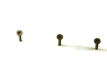 Image showing Three Screws in Line