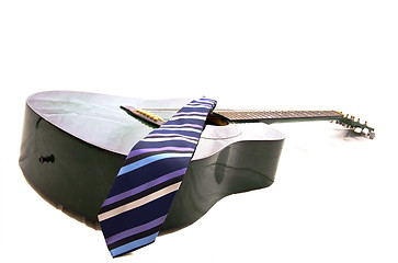 Image showing Acoustic guitar and business tie
