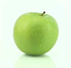 Image showing A fresh green apple with water drops