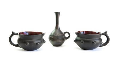 Image showing Two black decorative ceramic pots and small jug isolated