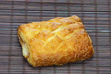 Image showing Freshly baked cinnamon roll on bakery paper 