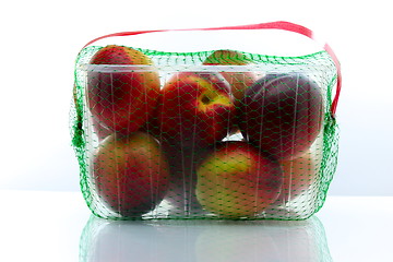 Image showing peaches packed in a plastic container