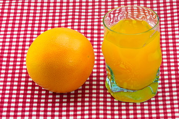 Image showing glass of orange juice and fruit