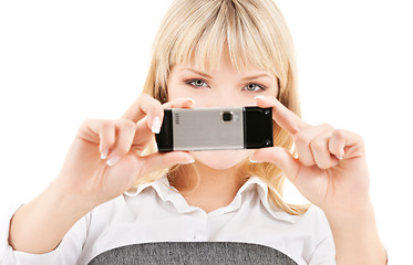 Image showing happy woman using phone camera