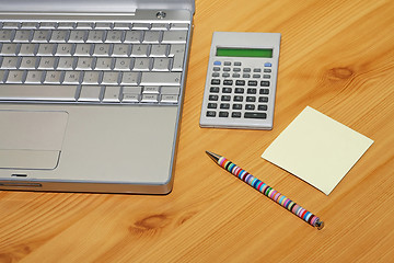 Image showing Calculator and notebook