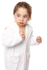 Image showing Little girl brushing her teeth - dental care