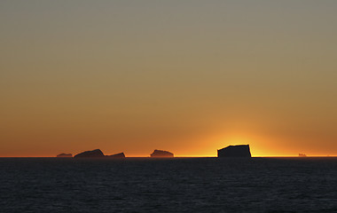 Image showing Icebergs at sunset