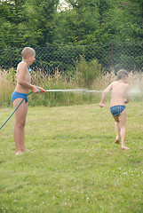 Image showing boys play on the grass