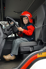 Image showing boy is sitting in a fire truck