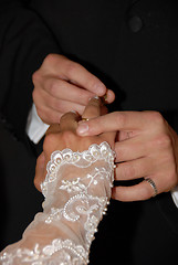 Image showing Wedding rings being exchanged