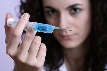 Image showing Portrait of a young doctor with syringa.