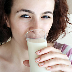 Image showing Young people eating milk with cereals