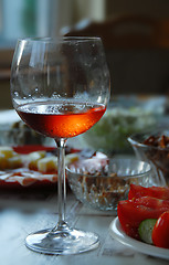 Image showing Wineglass with highlighted rose wine