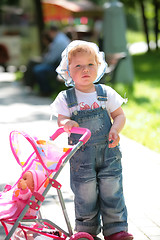 Image showing small girl in jeans overalls
