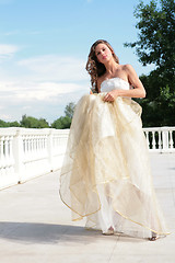 Image showing beautiful bride in golden dress