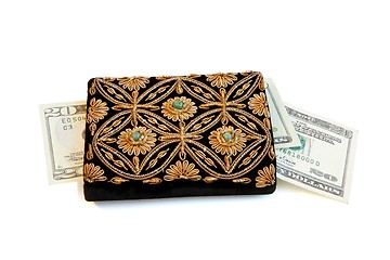 Image showing Embroidered woman purse and dollar banknotes isolated