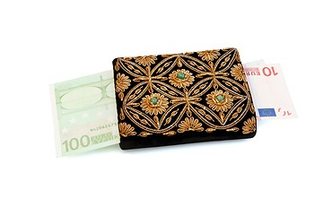 Image showing Embroidered woman purse and euro banknotes isolated