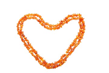 Image showing Amber beads double frame in shape of heart isolated 