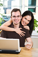 Image showing Happy couple shopping online