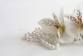 Image showing pearl necklace and silk flowers