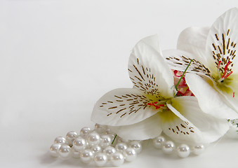 Image showing pearl necklace and silk flowers